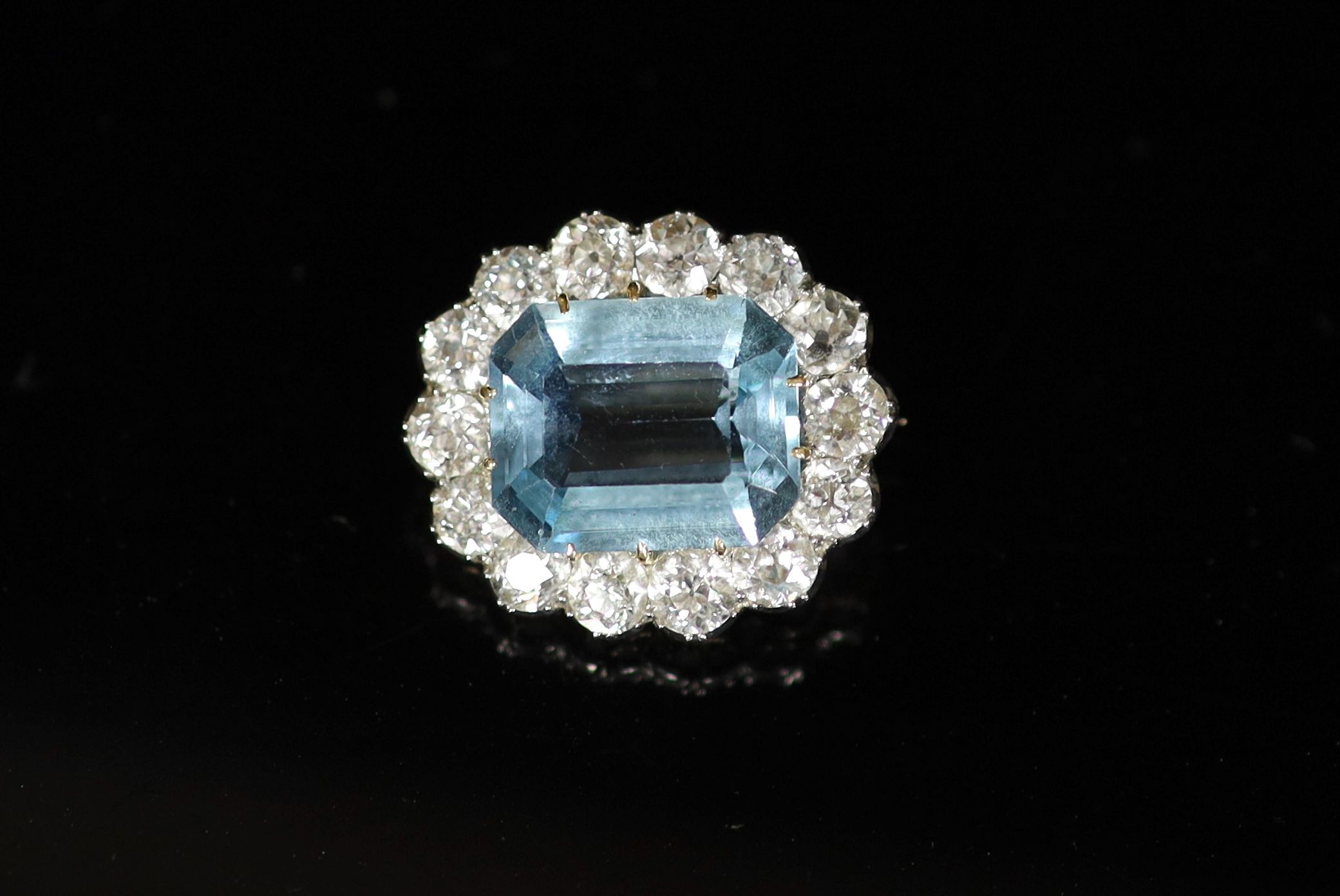 A gold and silver, aquamarine and diamond set oval cluster brooch